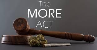A judge's gavel, cannabis bud, and joint are placed in front of text that reads "The MORE ACT" on a dark background.