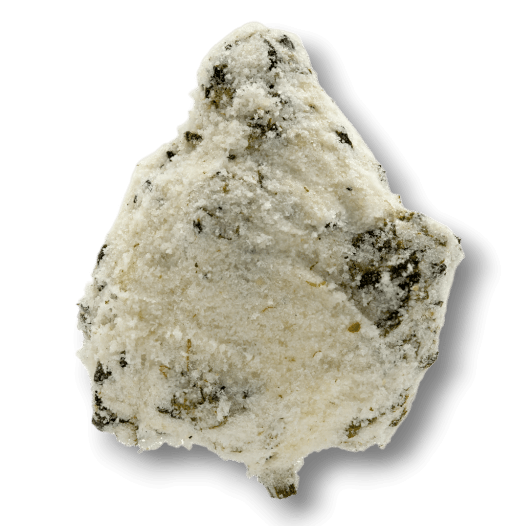 A white, powdery rock with dark speckles and an irregular shape, resembling premium snow caps THCA flower, is shown on a plain white background.