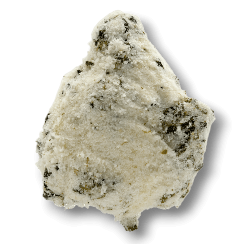A white, powdery rock with dark speckles and an irregular shape, resembling premium snow caps THCA flower, is shown on a plain white background.